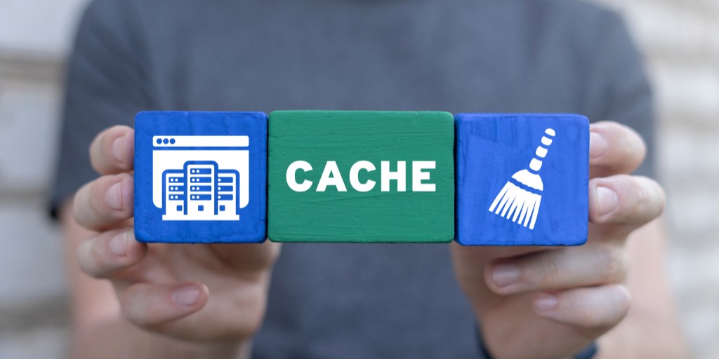 Man holding colorful blocks sees word: CACHE.