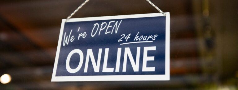 Sign reading "We're Open 24 Hours Online"