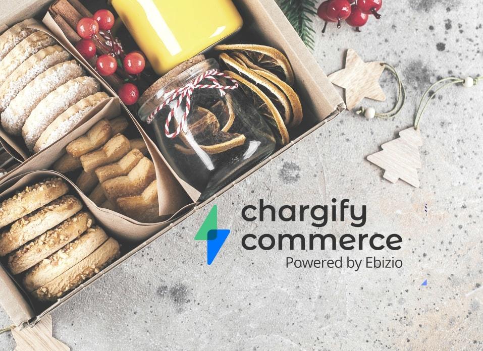 Box of Holiday Treats next to Chargify Commerce Logo on gray Christmas-themed background