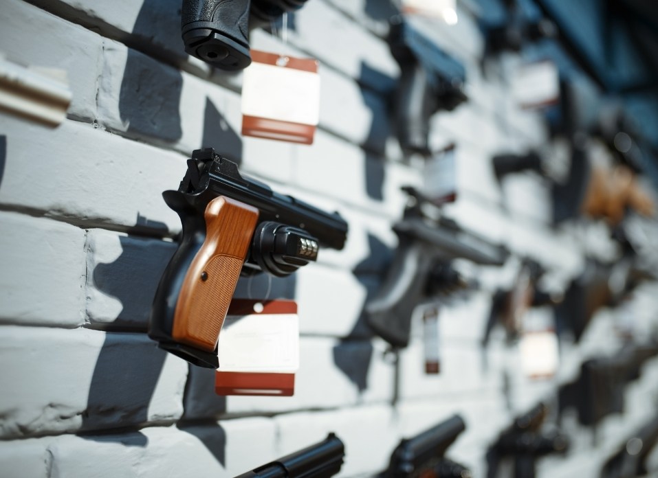 Handguns on showcase in gun shop closeup