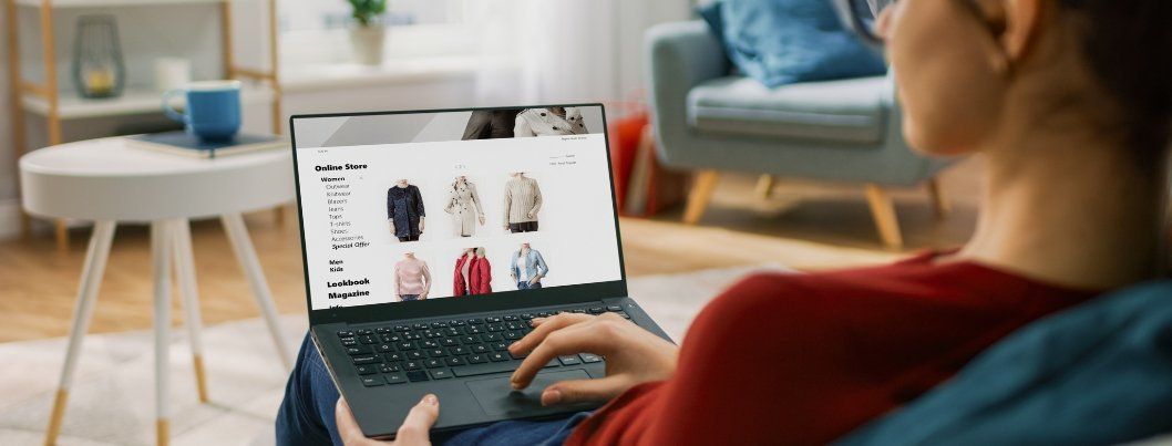 Young Woman at Home Using Laptop Computer for Browsing Through Online Retail Shopping Site. BigCommerce UX Design