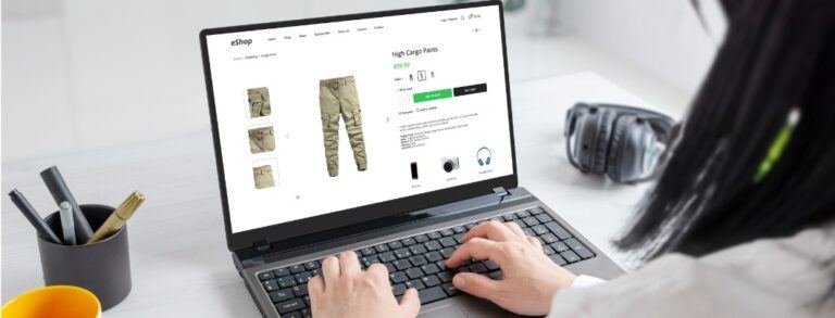 Person on laptop browsing online fashion store looking at cargo pants product page