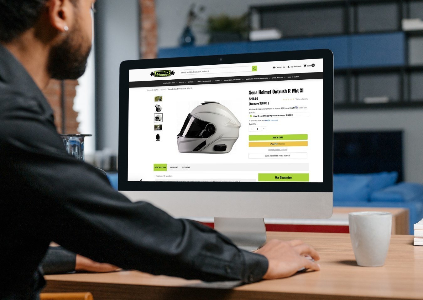 Man looking on desktop with MadPowerSports.com product page - BigCommerce Design BigCommerce Development