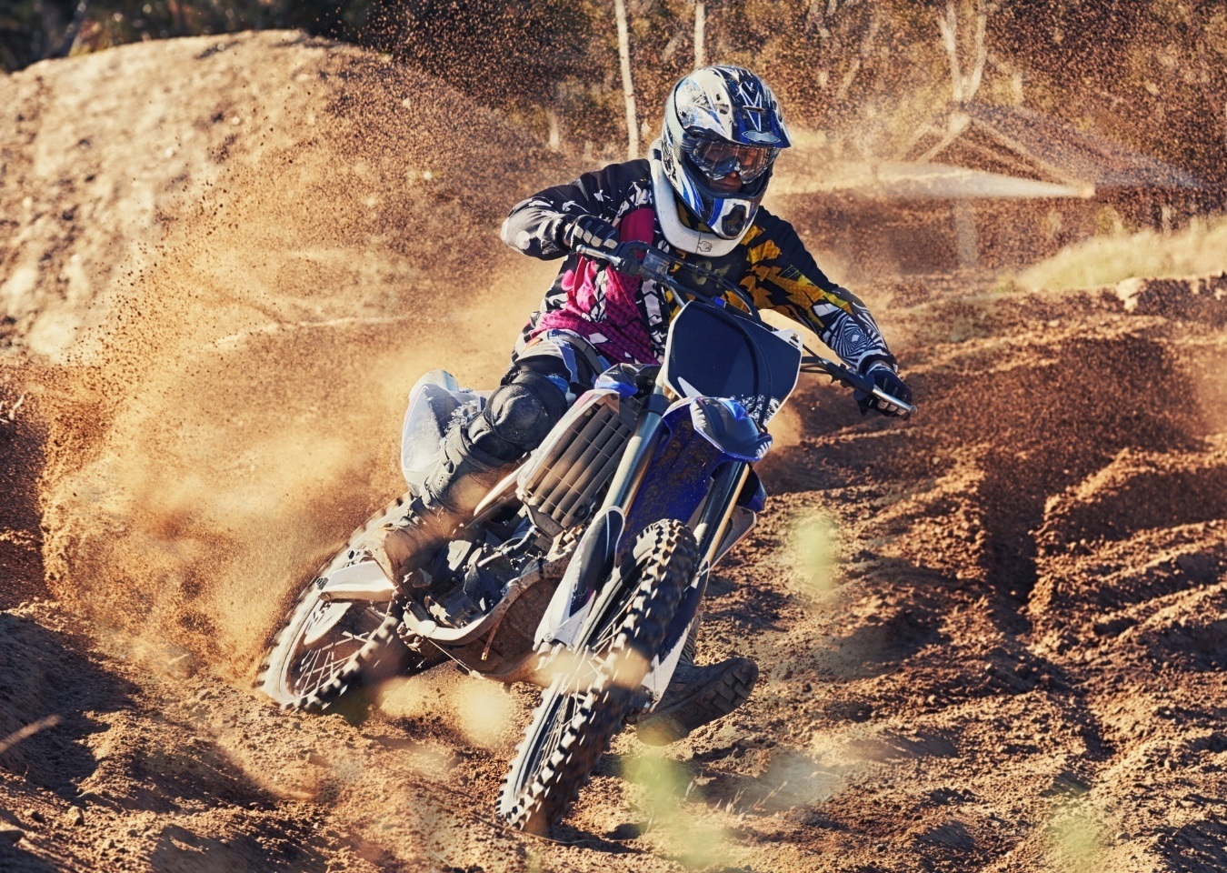 Person riding dirt bike in competition - BigCommerce design BigCommerce development